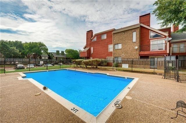 9809 Walnut Street, Unit E305 Dallas, TX 75243 - Photo 4 of 16 Community pool featuring a patio