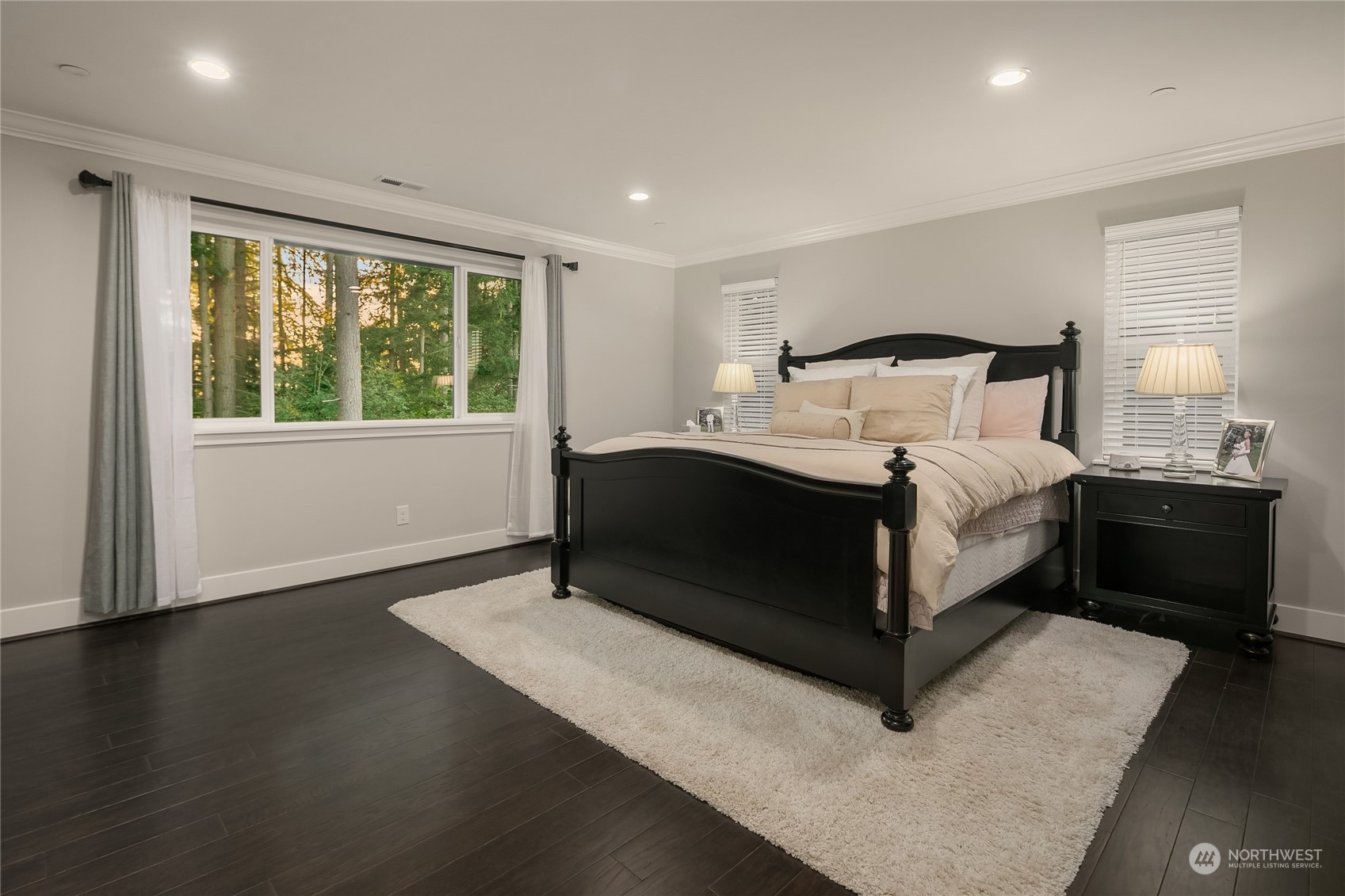 17221 93rd Place Northeast Bothell, WA 98011 - Photo 15 of 32 a bedroom with a bed lamp and a large window with outer view