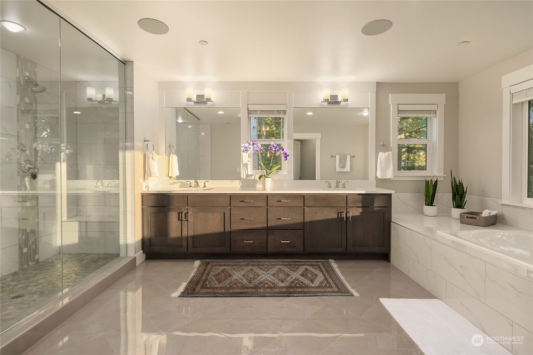 17221 93rd Place Northeast Bothell, WA 98011 - Photo 17 of 32 a large bathroom with a double vanity sink a mirror and a shower