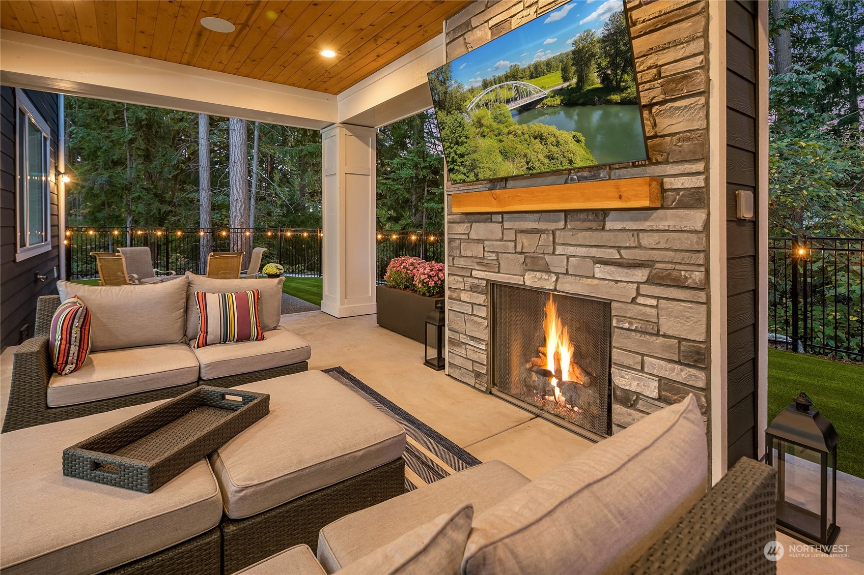 17221 93rd Place Northeast Bothell, WA 98011 - Photo 27 of 32 a living room with furniture a fireplace and a floor to ceiling window
