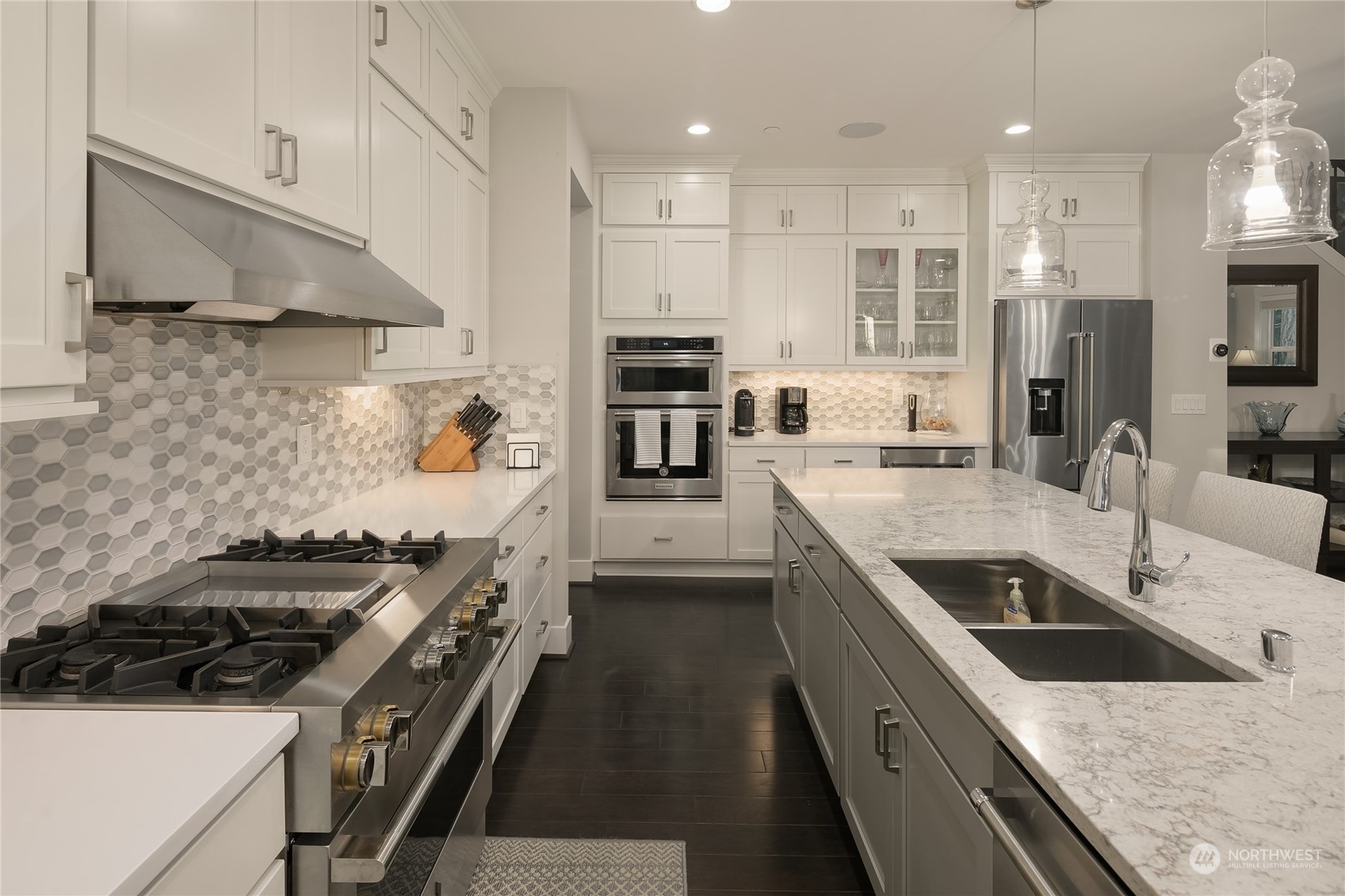 17221 93rd Place Northeast Bothell, WA 98011 - Photo 6 of 32 a kitchen with stainless steel appliances granite countertop a sink stove and refrigerator