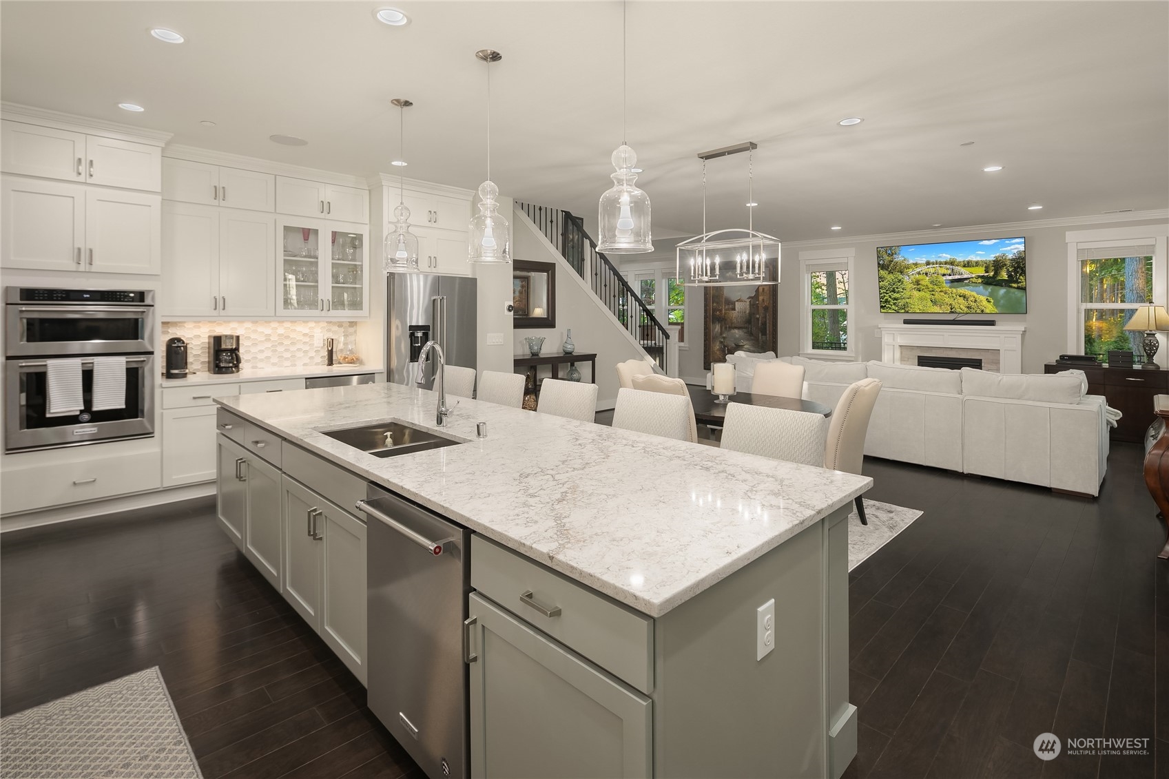 17221 93rd Place Northeast Bothell, WA 98011 - Photo 8 of 32 a kitchen with stainless steel appliances granite countertop a sink a stove and a wooden floors