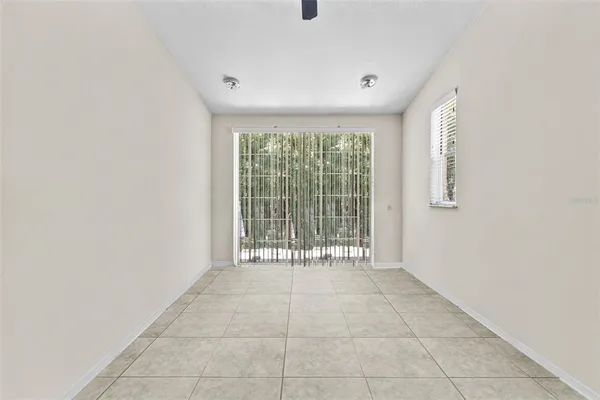 a view of an empty room with glass door