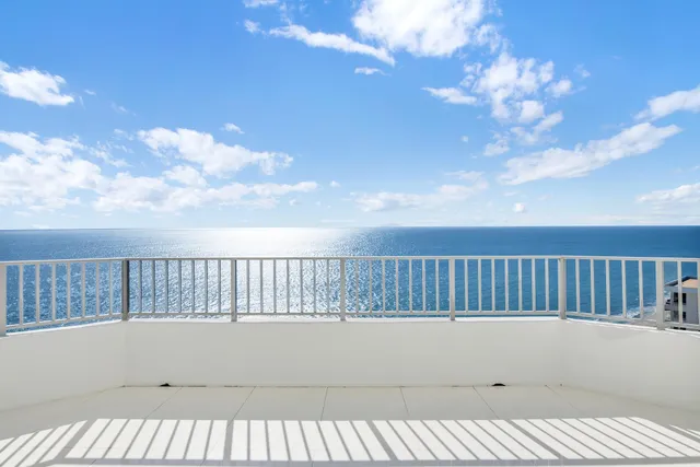 a view of balcony with wooden floor