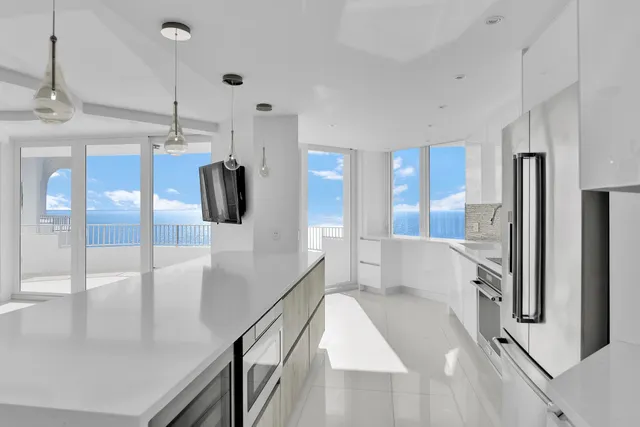 a spacious bathroom with a granite countertop sink mirror and shower