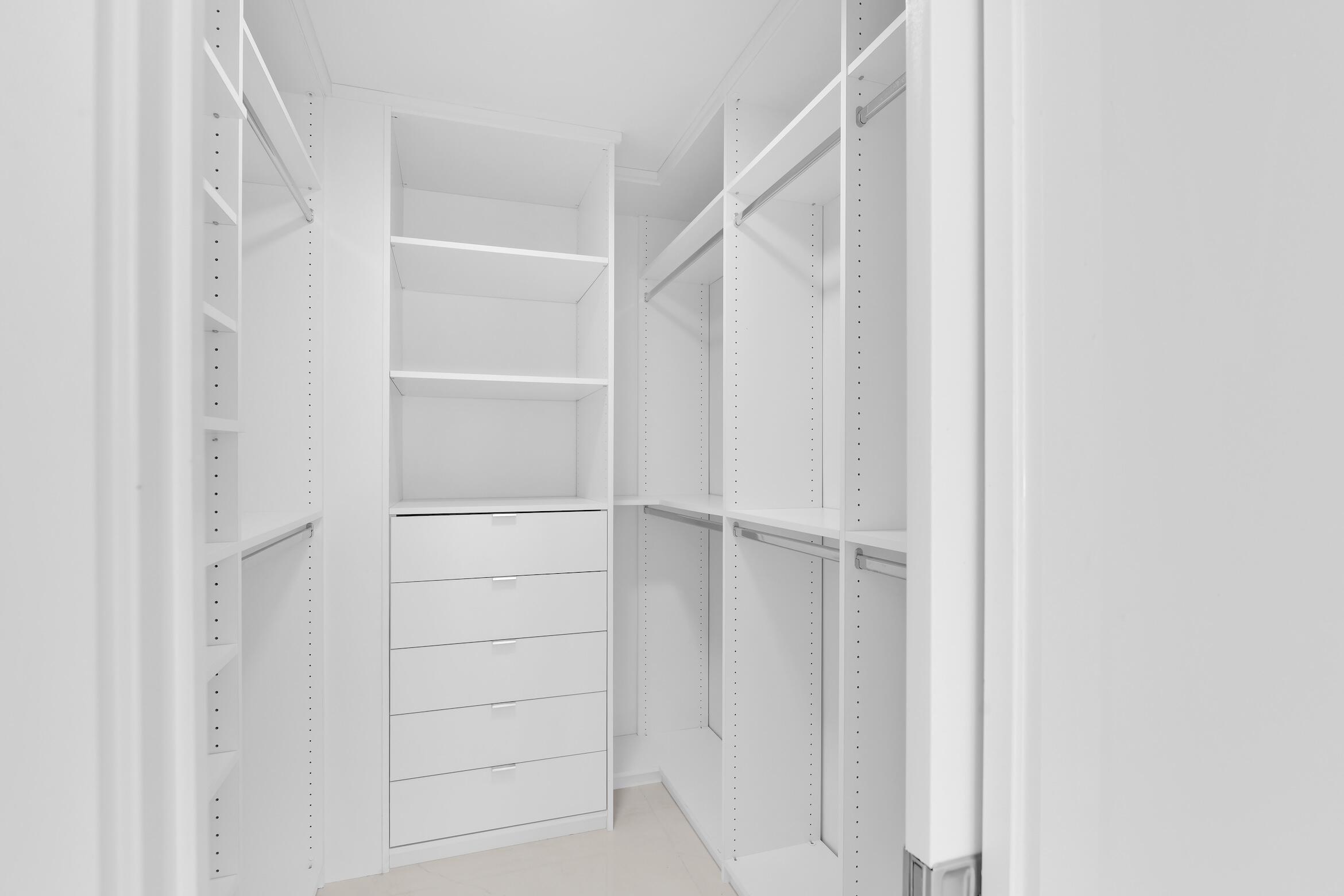 550 South Ocean Boulevard, Unit PH06 Boca Raton, FL 33432 - Photo 24 of 62 a view of walk in closet with empty racks
