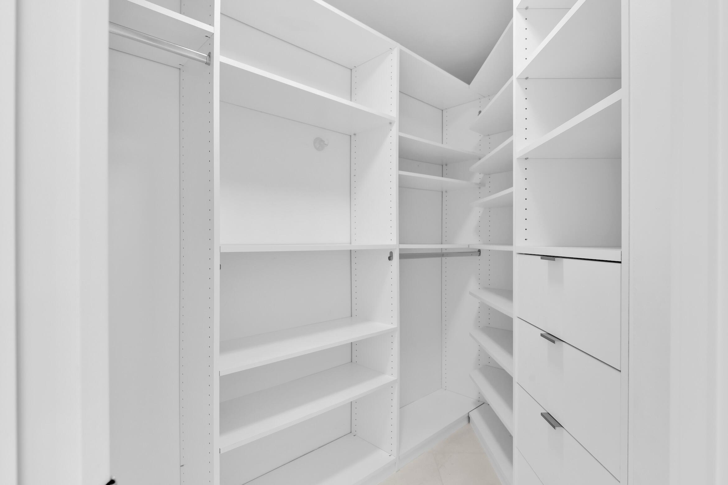 550 South Ocean Boulevard, Unit PH06 Boca Raton, FL 33432 - Photo 26 of 62 a view of walk in closet with empty racks