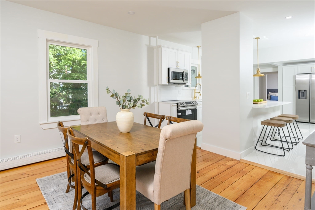 120 Broadway Hanover, MA 02339 - Photo 11 of 35 a view of a dining room with furniture and wooden floor
