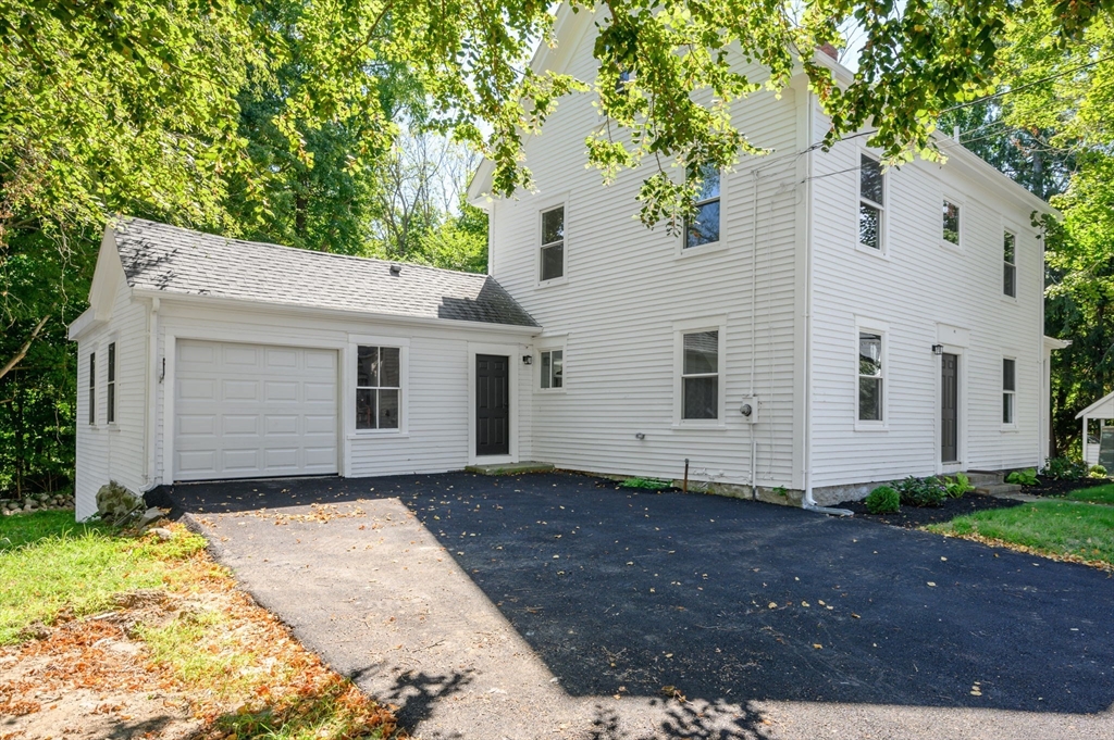 120 Broadway Hanover, MA 02339 - Photo 2 of 35 a front view of house with yard