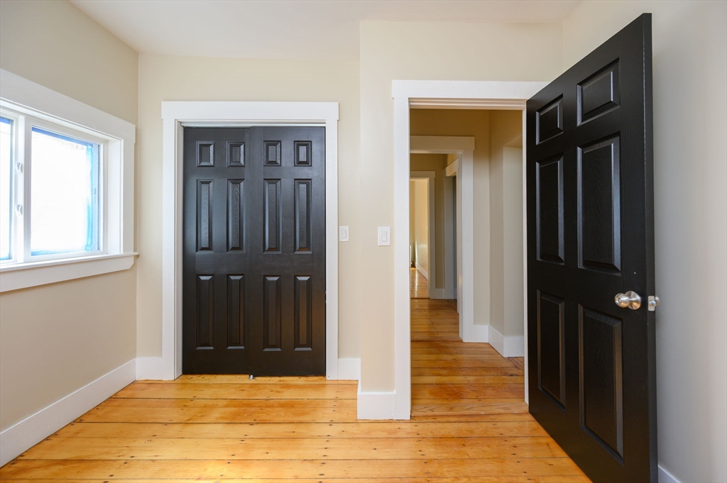 120 Broadway Hanover, MA 02339 - Photo 26 of 35 a view of a hallway with wooden floor and staircase