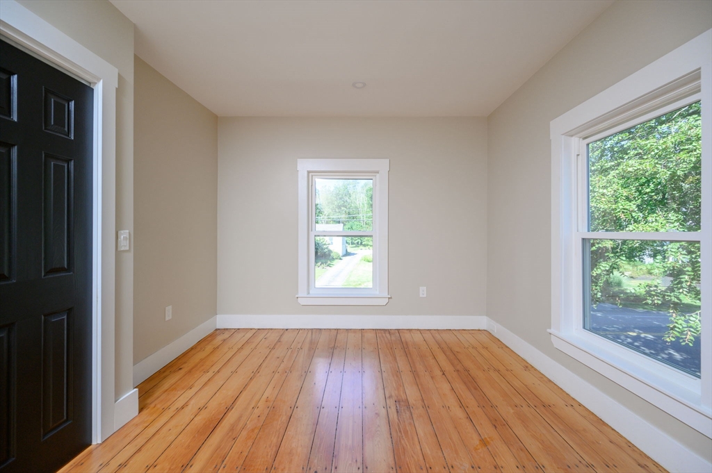 120 Broadway Hanover, MA 02339 - Photo 28 of 35 a view of an empty room with wooden floor and a window