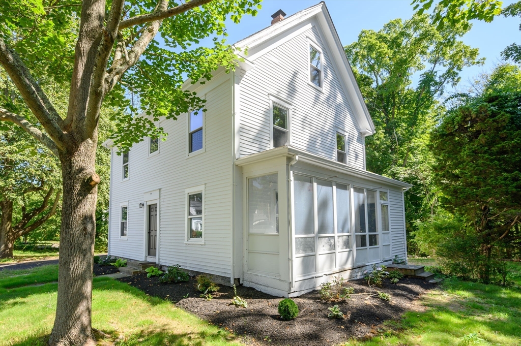 120 Broadway Hanover, MA 02339 - Photo 3 of 35 a view of a house with a yard