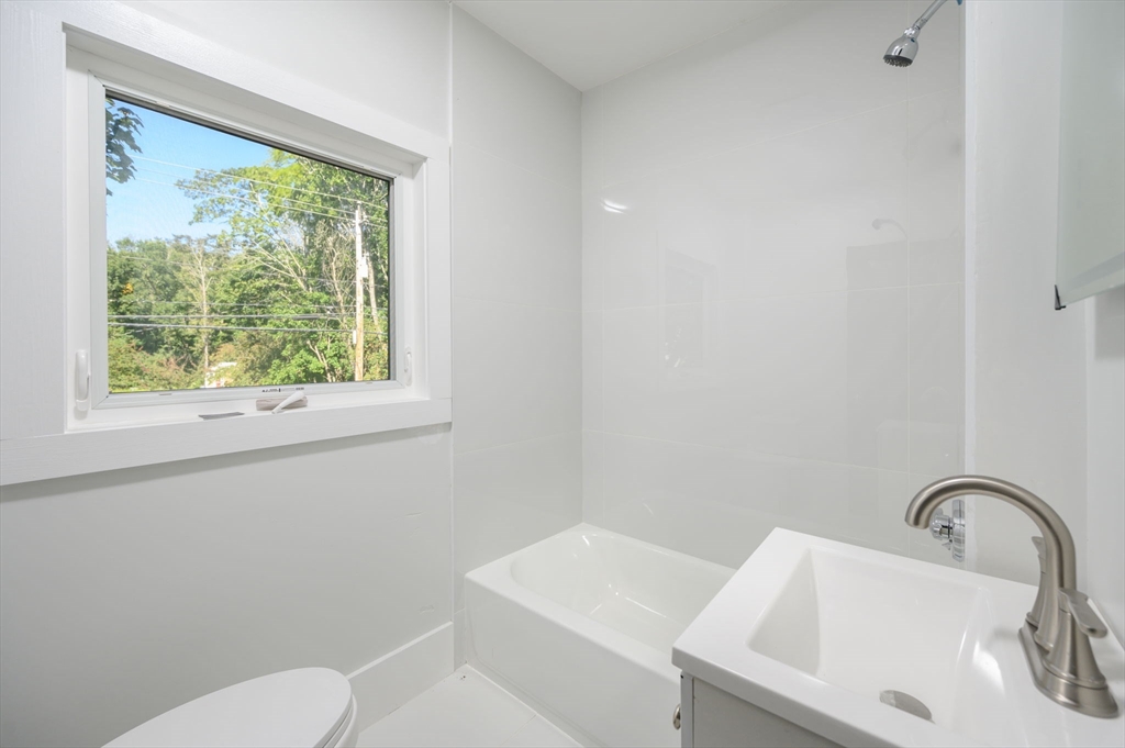 120 Broadway Hanover, MA 02339 - Photo 31 of 35 a bathroom with a sink and a toilet