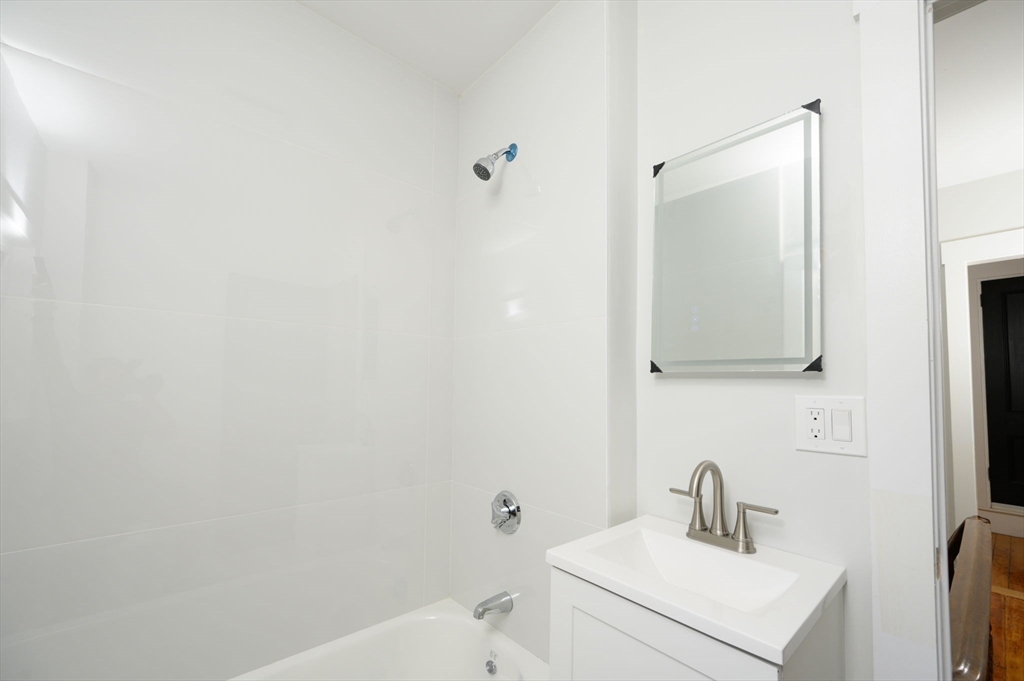 120 Broadway Hanover, MA 02339 - Photo 32 of 35 a bathroom with a sink and a mirror