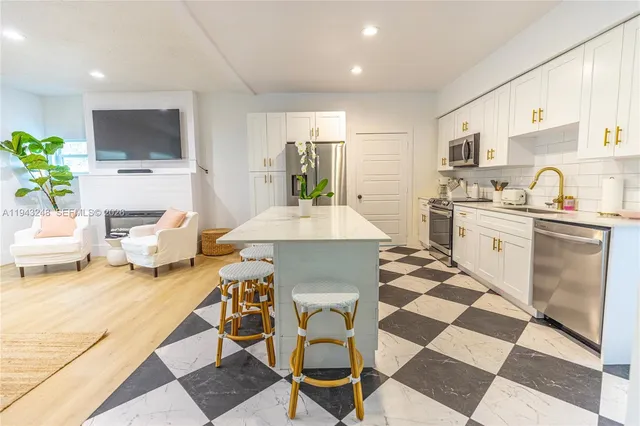 a kitchen with a dining table and chairs