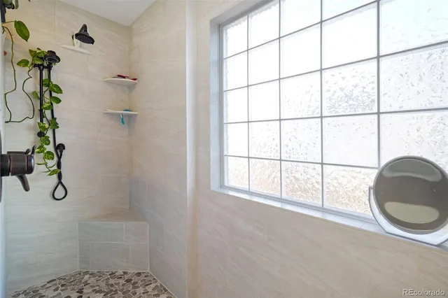 a living room with furniture a piano and a window