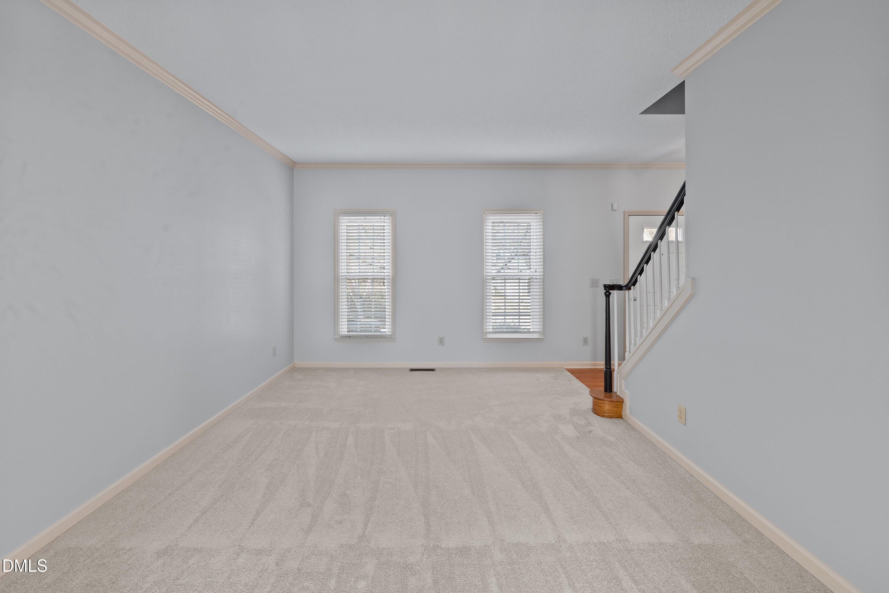 113 Laurel Branch Drive Cary, NC 27513 - Photo 10 of 40 a view of an empty room with windows