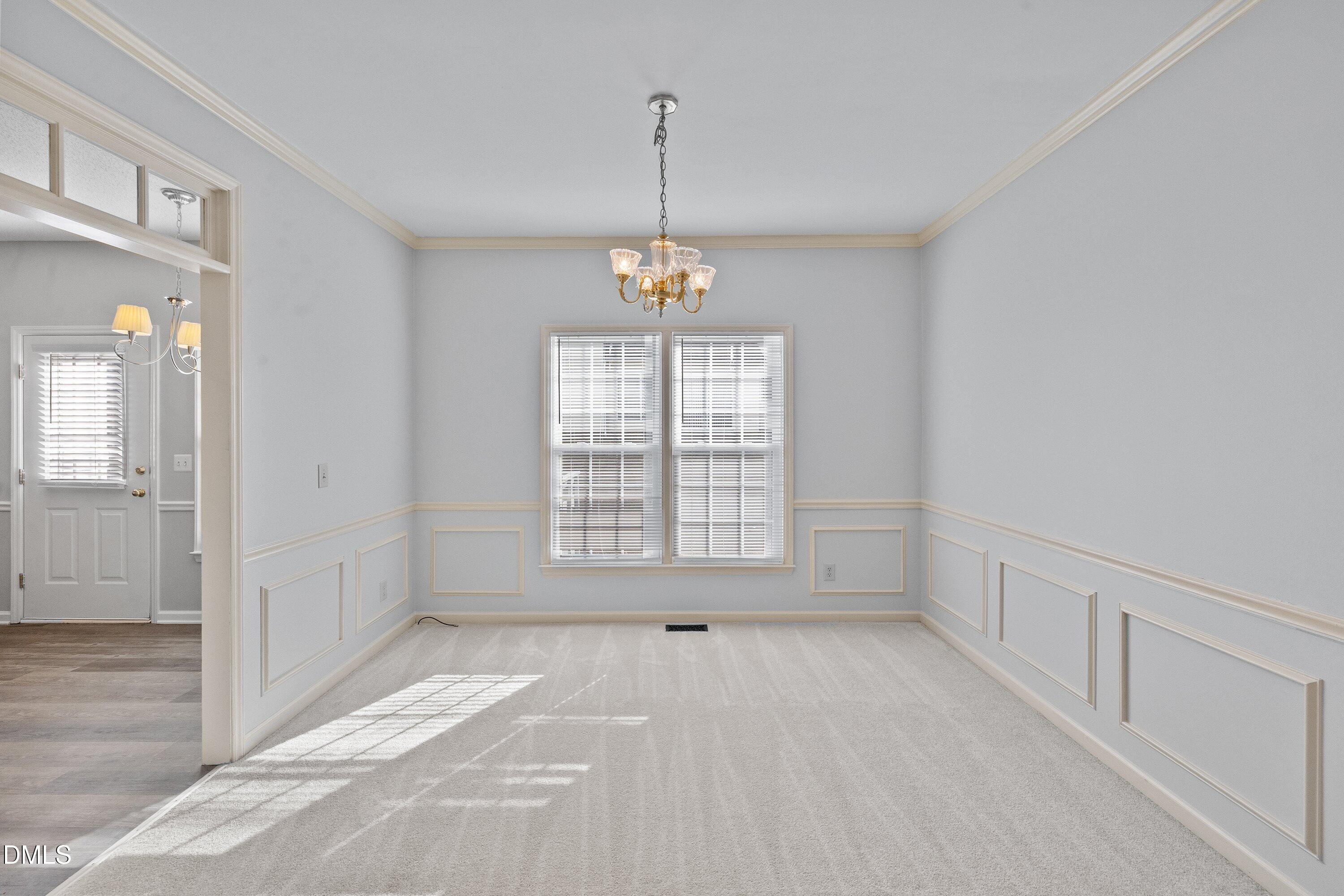 113 Laurel Branch Drive Cary, NC 27513 - Photo 11 of 40 a view of an empty room with a window