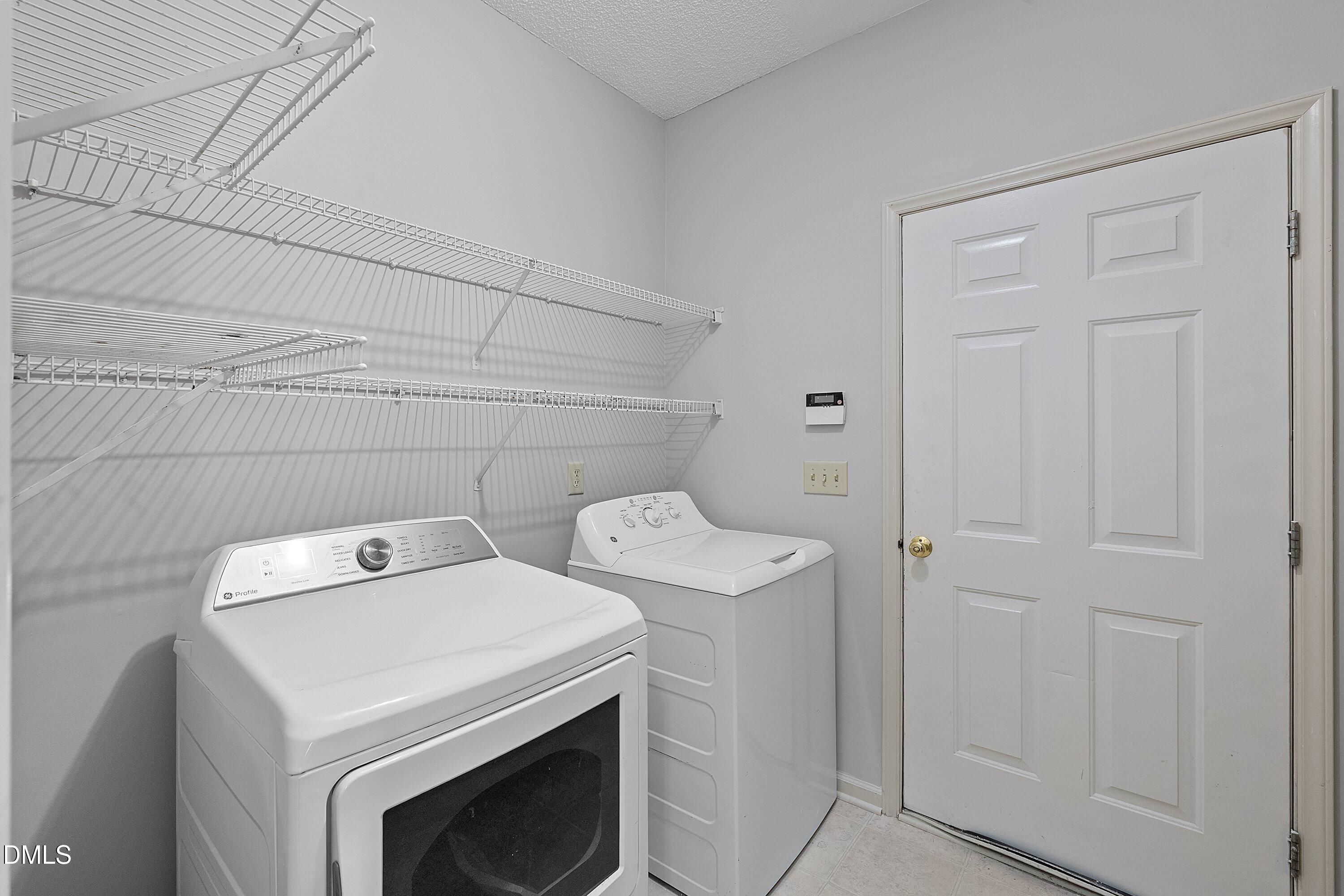 113 Laurel Branch Drive Cary, NC 27513 - Photo 22 of 40 a utility room with dryer and washer