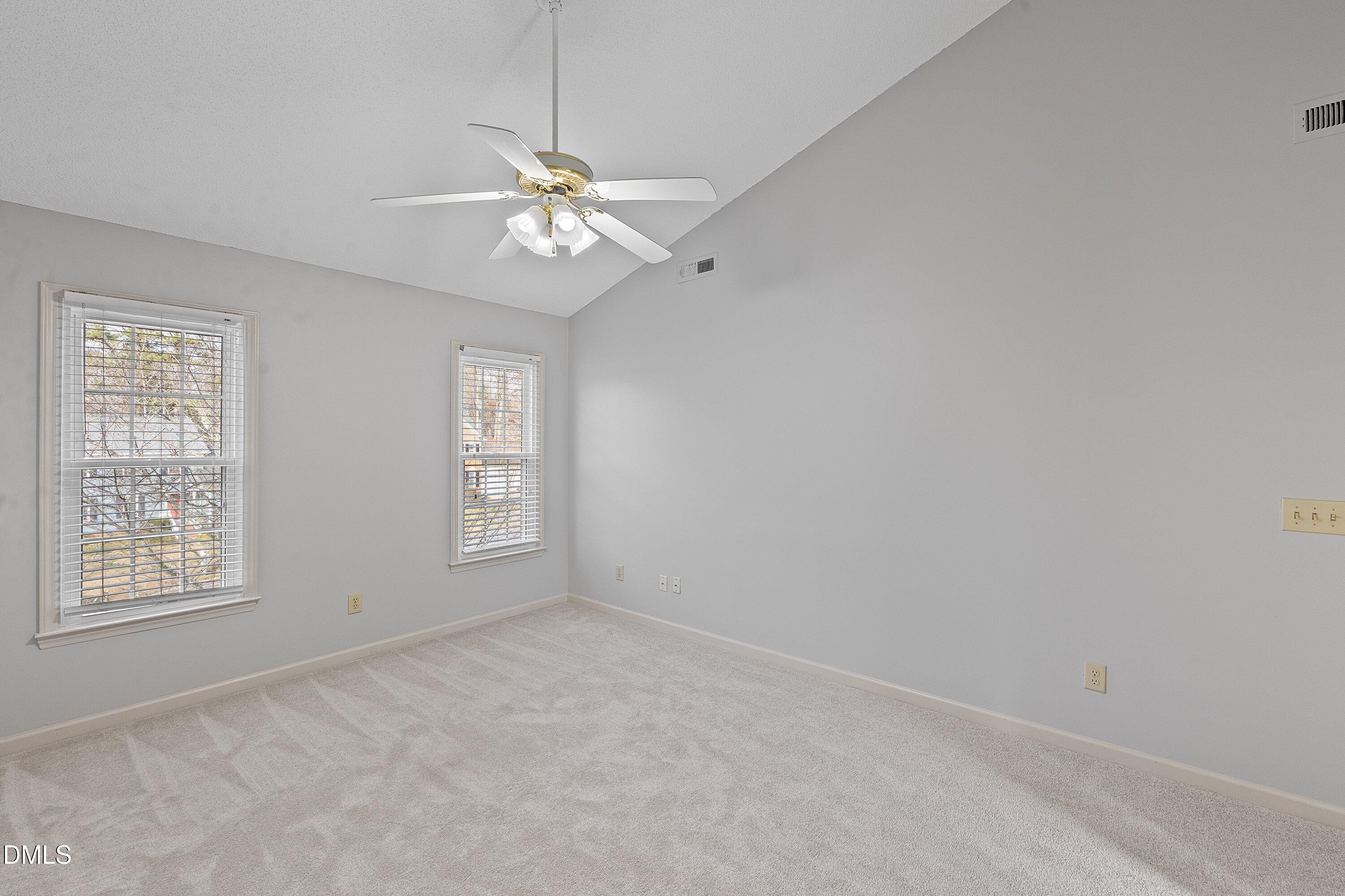 113 Laurel Branch Drive Cary, NC 27513 - Photo 26 of 40 an empty room with windows and fan
