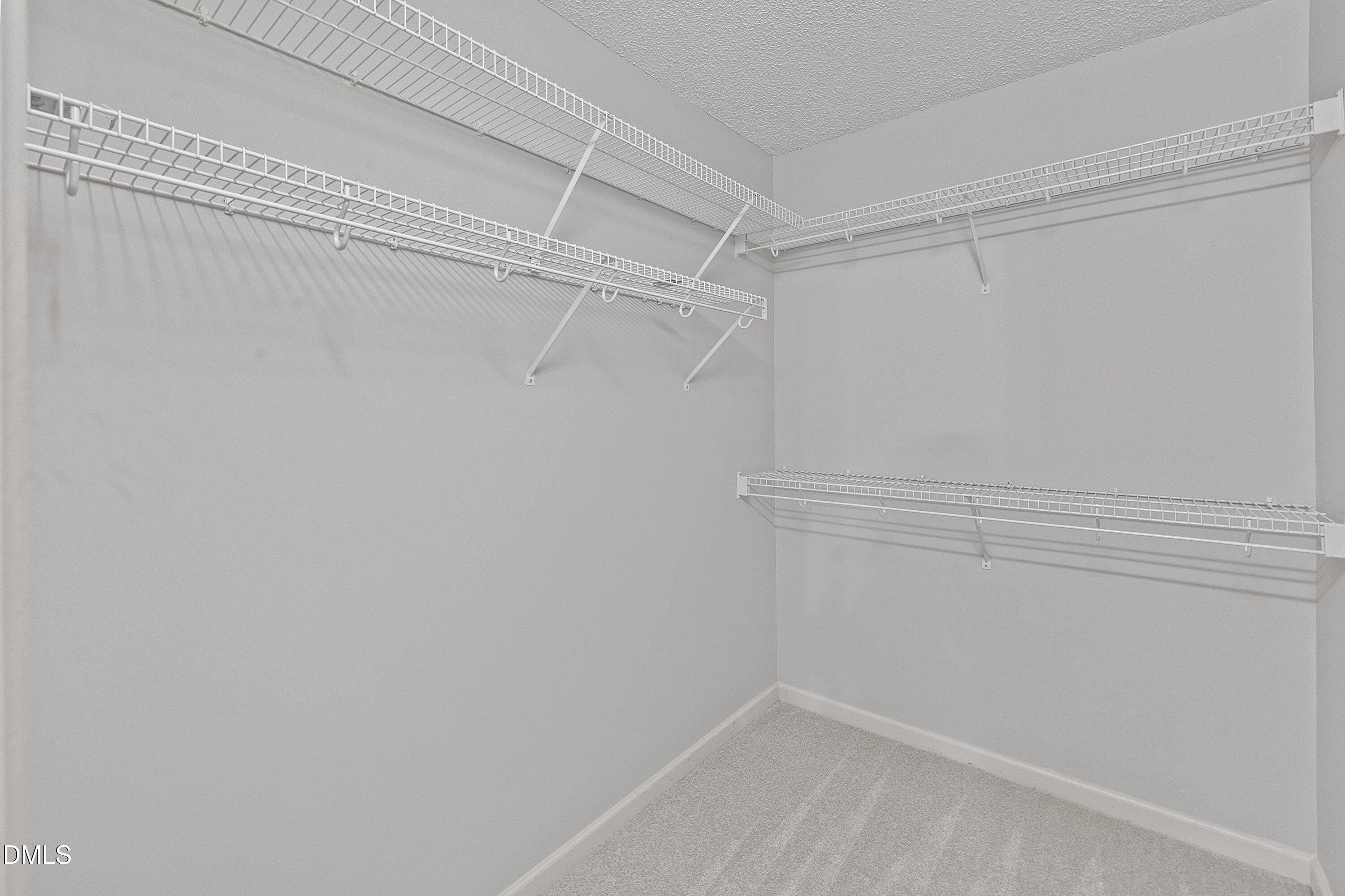 113 Laurel Branch Drive Cary, NC 27513 - Photo 27 of 40 a view of a room with racks on the wall
