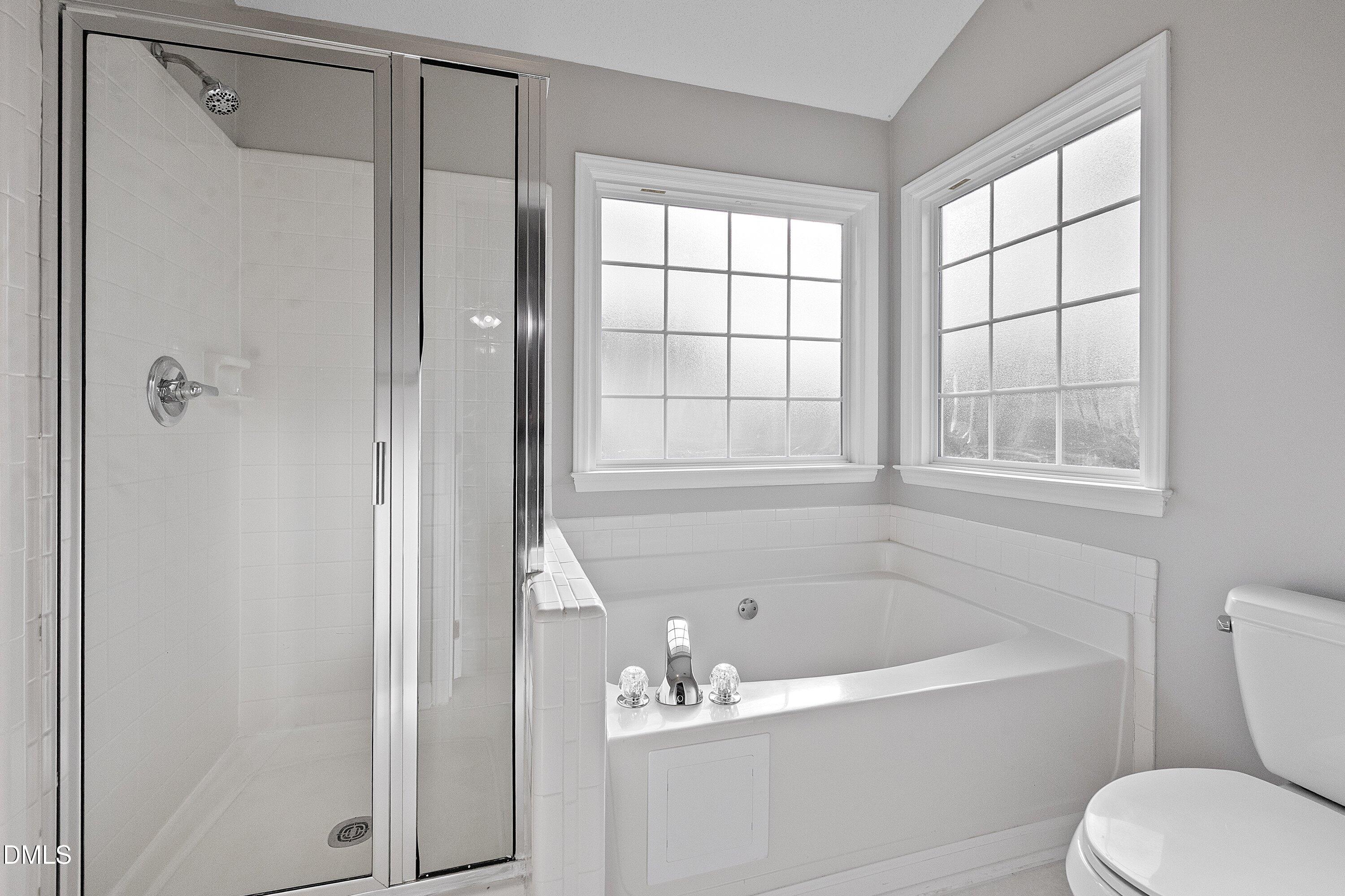 113 Laurel Branch Drive Cary, NC 27513 - Photo 29 of 40 a bath room with a bath tub and a shower