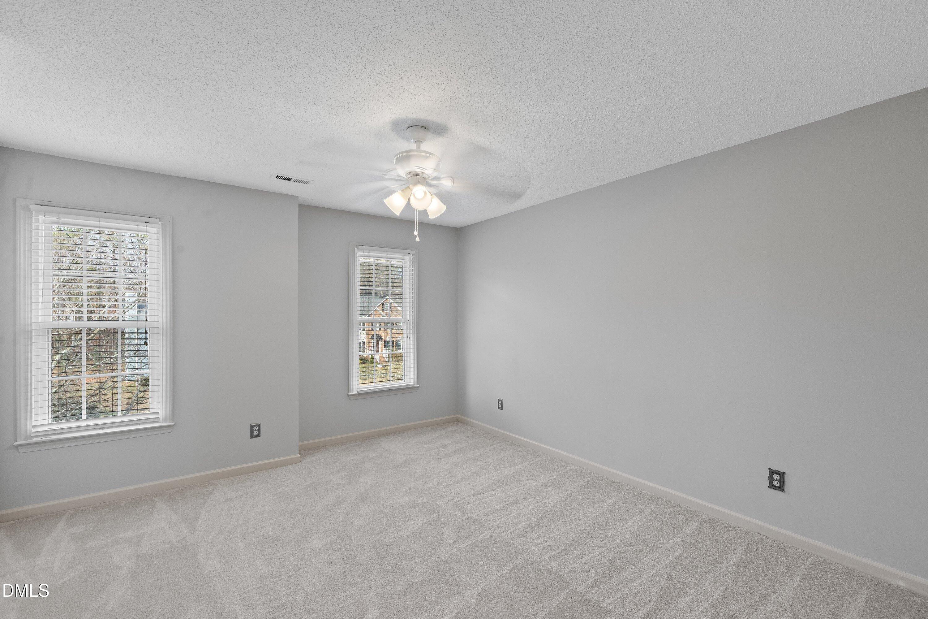 113 Laurel Branch Drive Cary, NC 27513 - Photo 31 of 40 a view of an empty room with a window