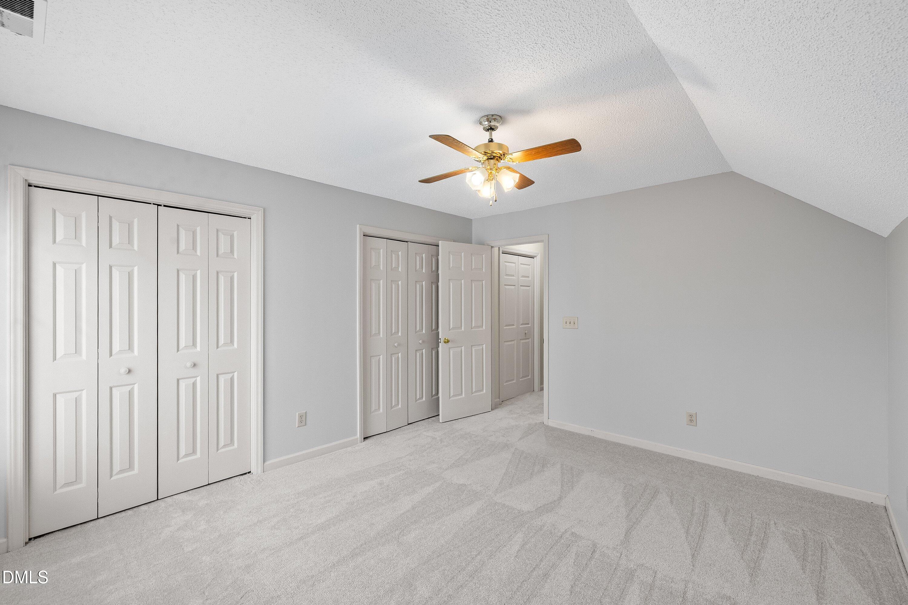113 Laurel Branch Drive Cary, NC 27513 - Photo 36 of 40 an empty room with a window and a ceiling fan