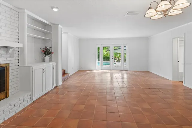 a bathroom with a granite countertop sink a mirror and shower