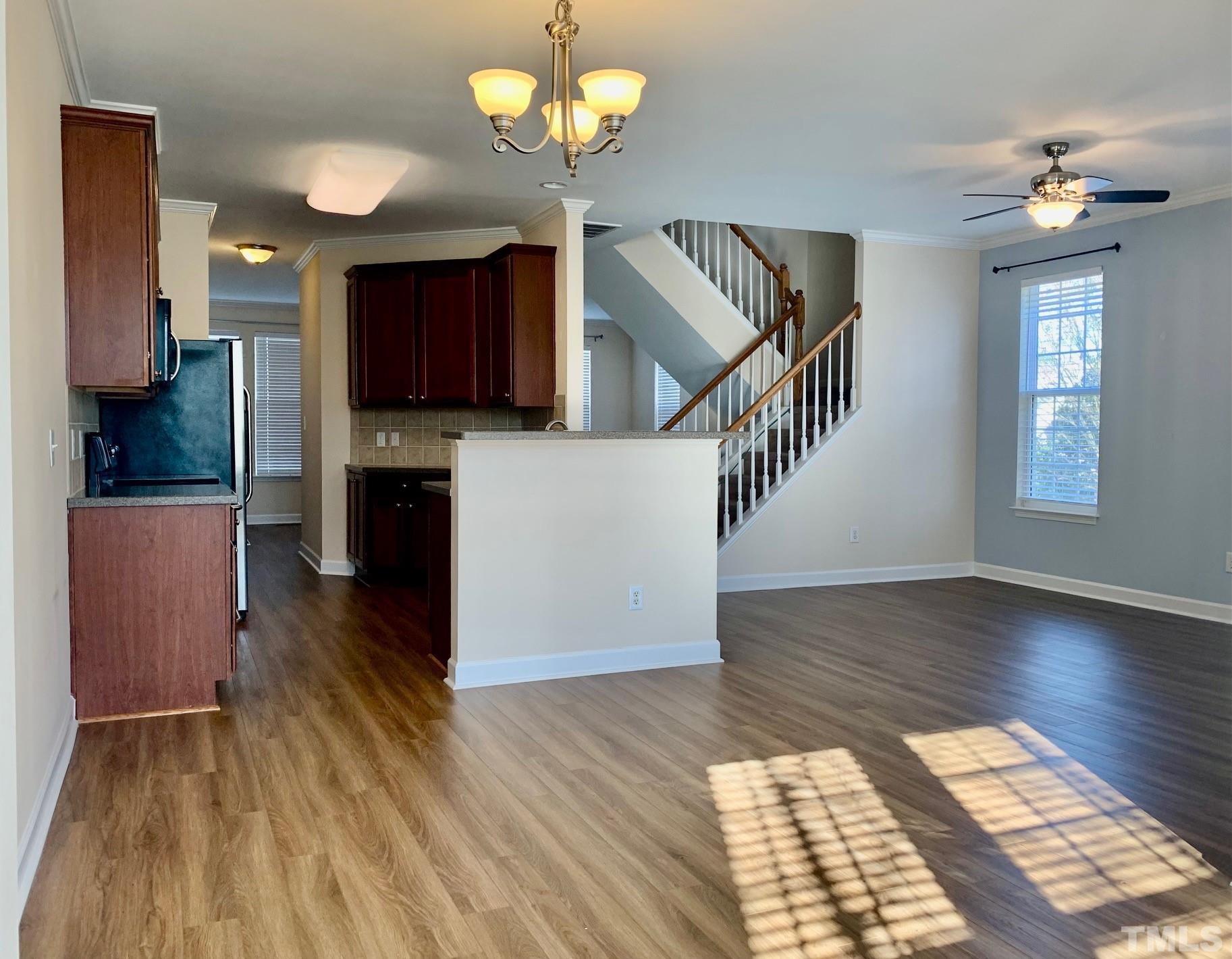 241 Grenoch Valley Lane Apex, NC 27539 - Photo 12 of 27 a view of kitchen with microwave and wooden floor
