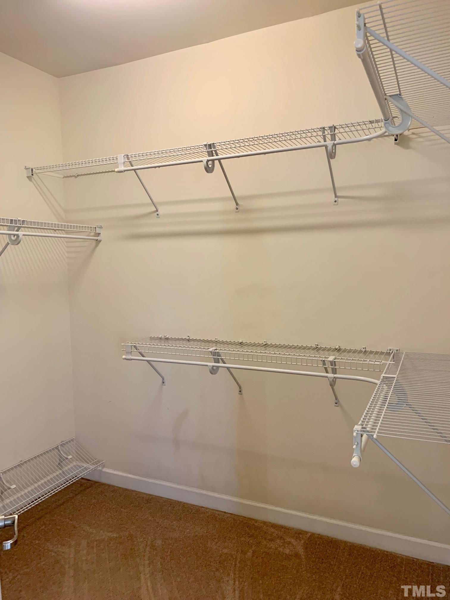 241 Grenoch Valley Lane Apex, NC 27539 - Photo 18 of 27 a view of a room with racks on the wall