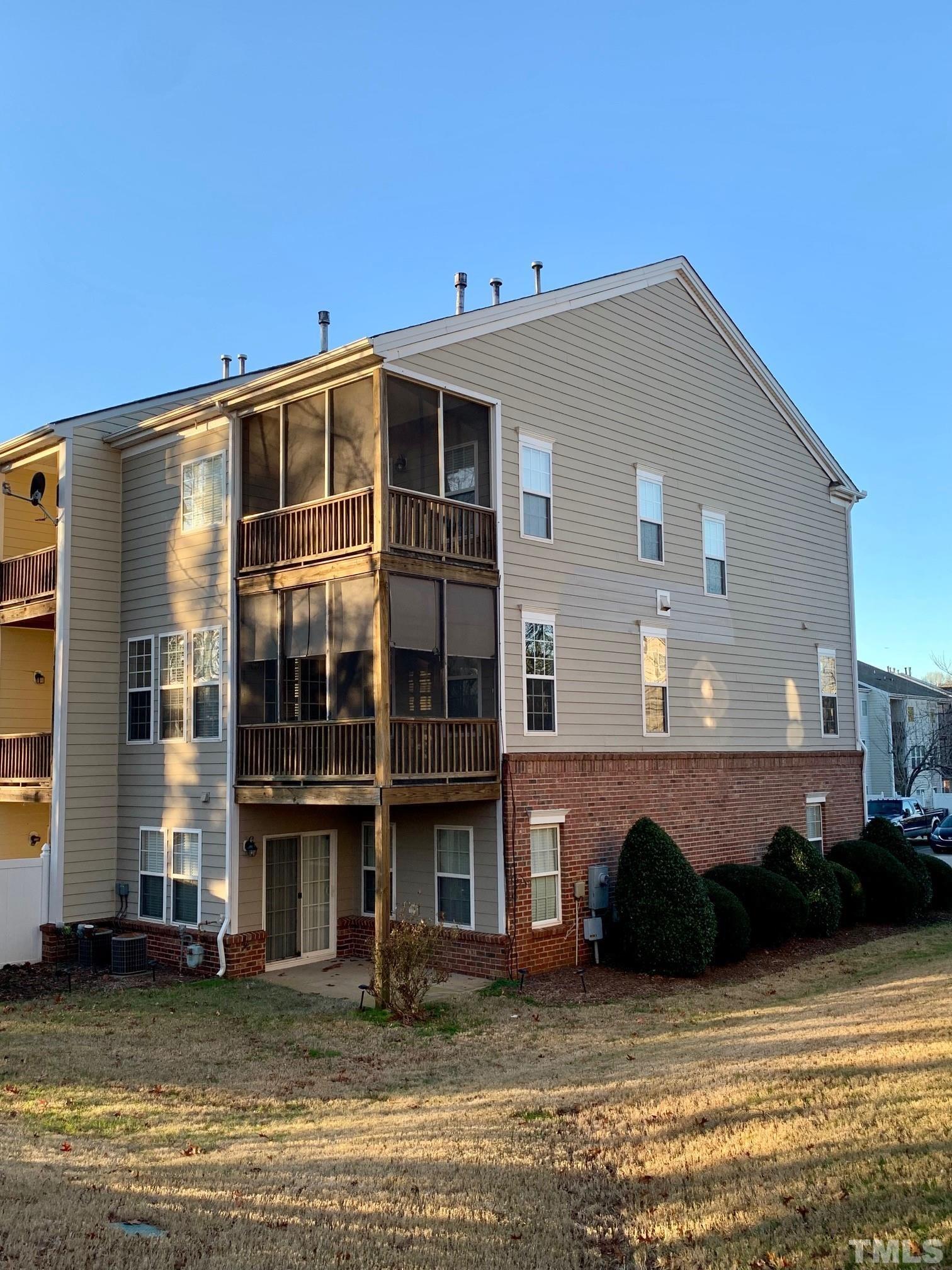 241 Grenoch Valley Lane Apex, NC 27539 - Photo 2 of 27 a view of a building with a large window and sitting area