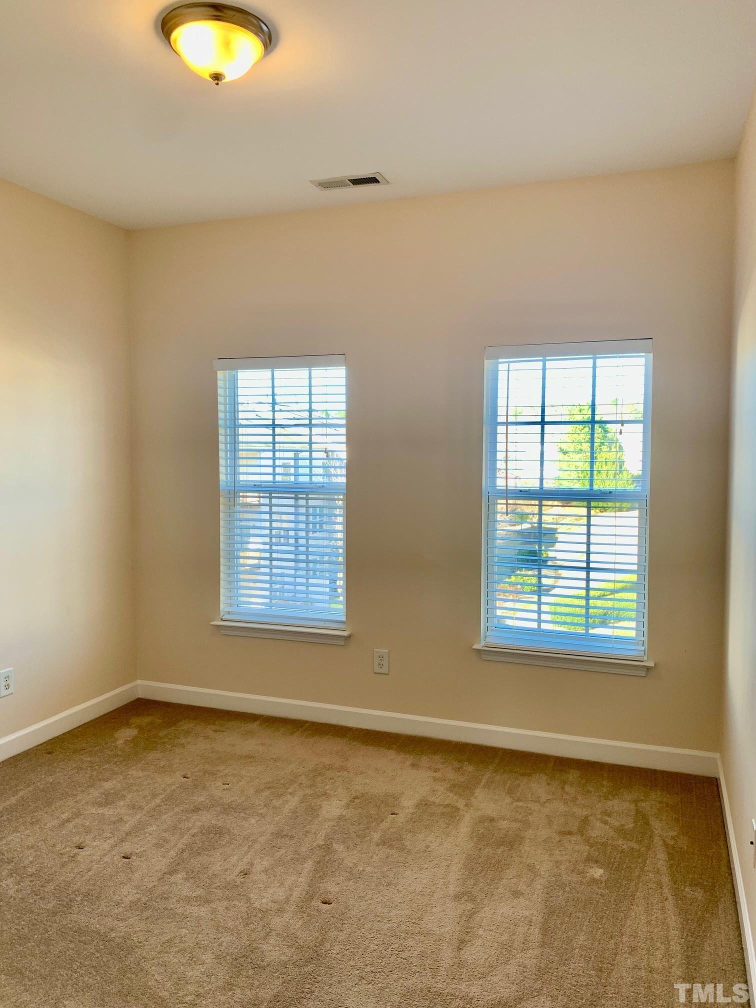 241 Grenoch Valley Lane Apex, NC 27539 - Photo 22 of 27 an empty room with a window