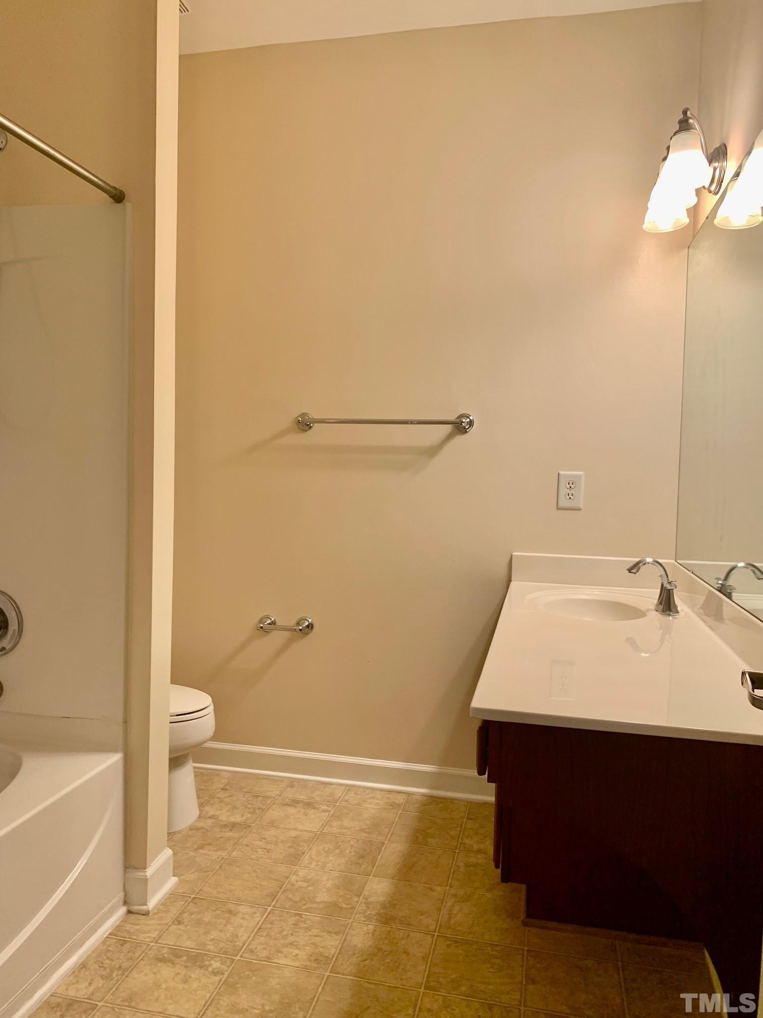 241 Grenoch Valley Lane Apex, NC 27539 - Photo 23 of 27 a bathroom with a sink and a mirror