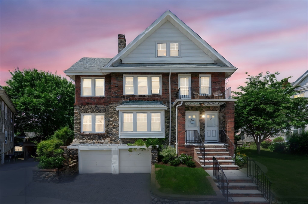 29 Hillcrest Circle, Unit 2 Watertown, MA 02472 - Photo 2 of 36 a front view of a house with a yard