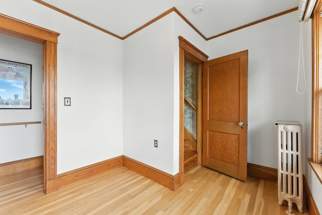 29 Hillcrest Circle, Unit 2 Watertown, MA 02472 - Photo 24 of 36 a view of hallway with wooden floor