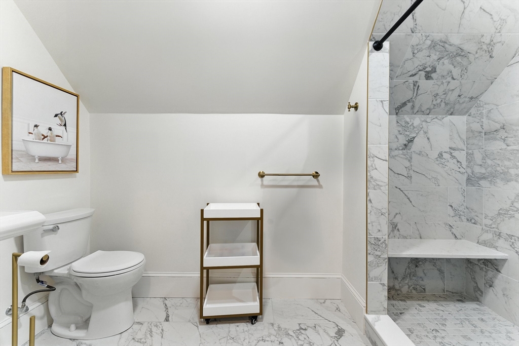 29 Hillcrest Circle, Unit 2 Watertown, MA 02472 - Photo 27 of 36 a white toilet sitting next to a bathroom