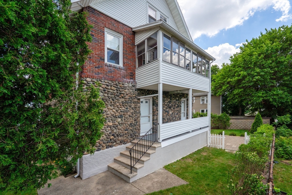 29 Hillcrest Circle, Unit 2 Watertown, MA 02472 - Photo 31 of 36 a view of house with a yard