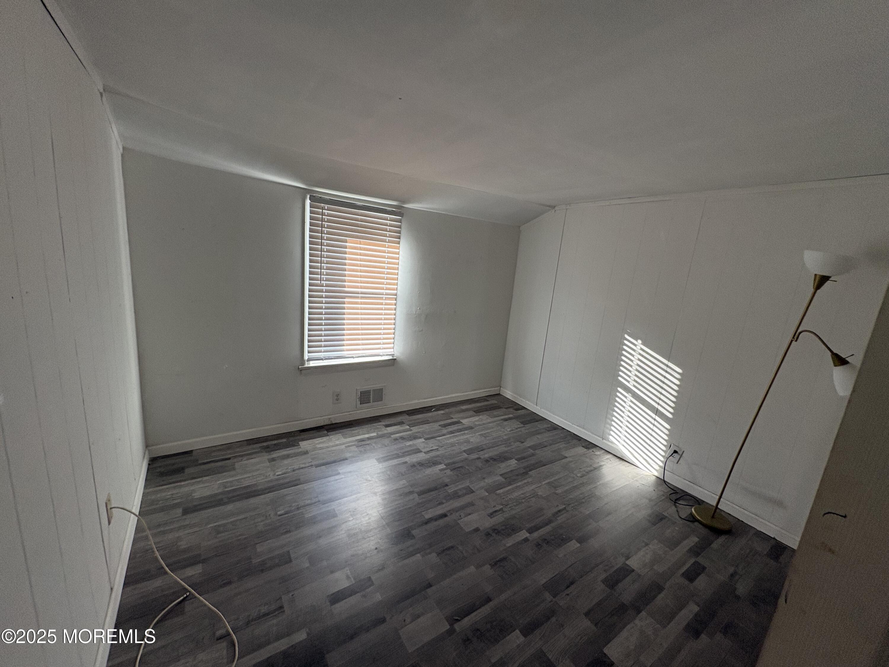 276 Linden Avenue North Middletown, NJ 07748 - Photo 10 of 15 an empty room with wooden floor and windows