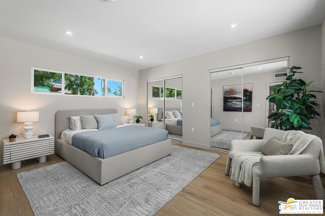 1433 North Fiesta Road Palm Springs, CA 92262 - Photo 17 of 30 a spacious bedroom with a bed and a couch
