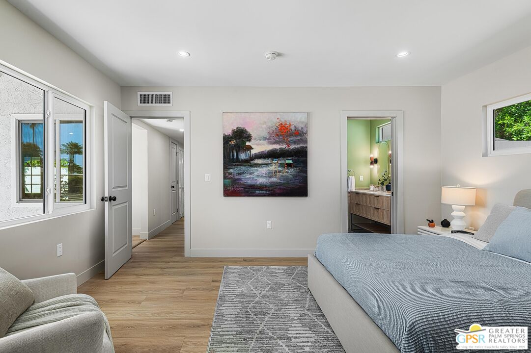 1433 North Fiesta Road Palm Springs, CA 92262 - Photo 18 of 30 a bedroom with a bed and glass window