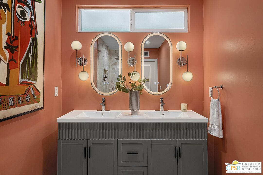 1433 North Fiesta Road Palm Springs, CA 92262 - Photo 22 of 30 a bathroom with a double vanity sink and a mirror