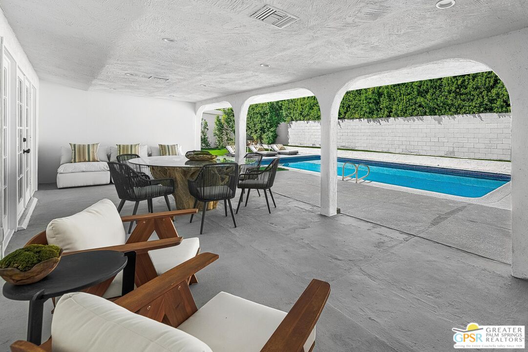 1433 North Fiesta Road Palm Springs, CA 92262 - Photo 24 of 30 a view of a dining room with furniture window and outside view
