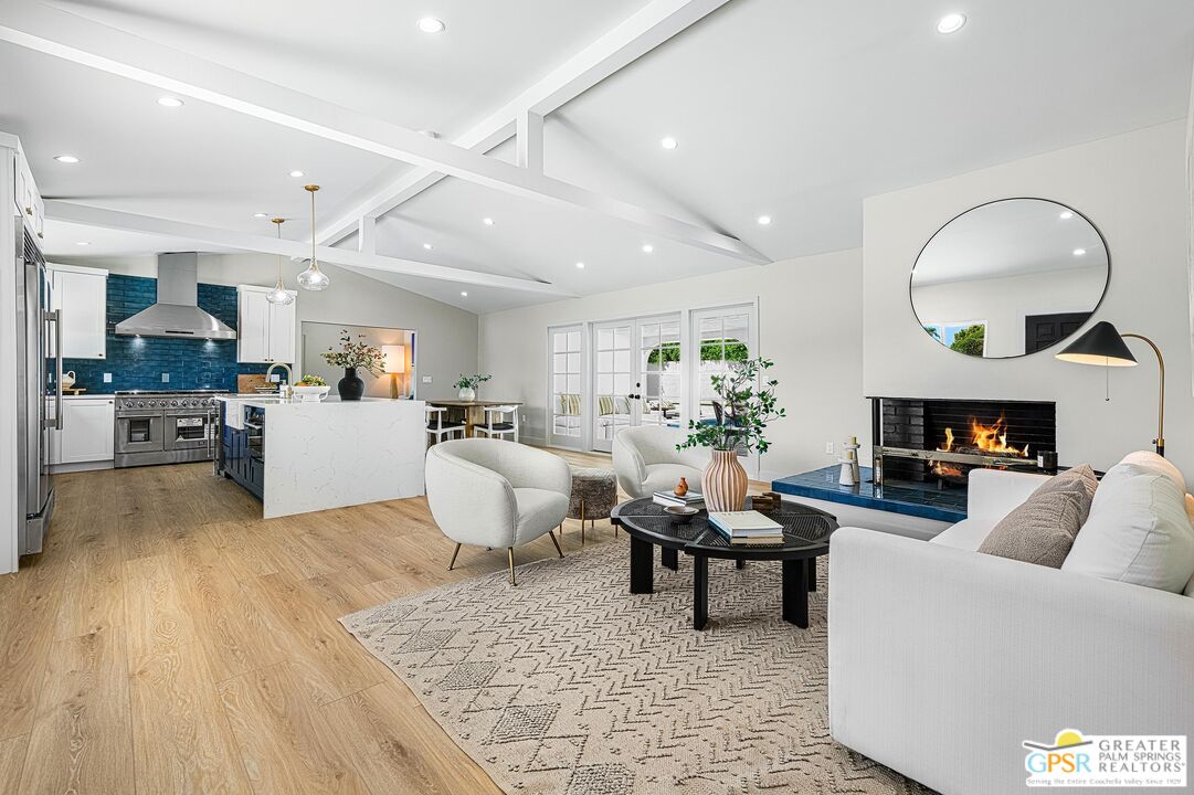 1433 North Fiesta Road Palm Springs, CA 92262 - Photo 3 of 30 a living room with furniture and a fireplace