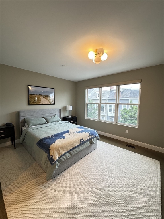 278 West Fifth Street, Unit 1 Boston, MA 02127 - Photo 15 of 22 a bedroom with a bed and a large window