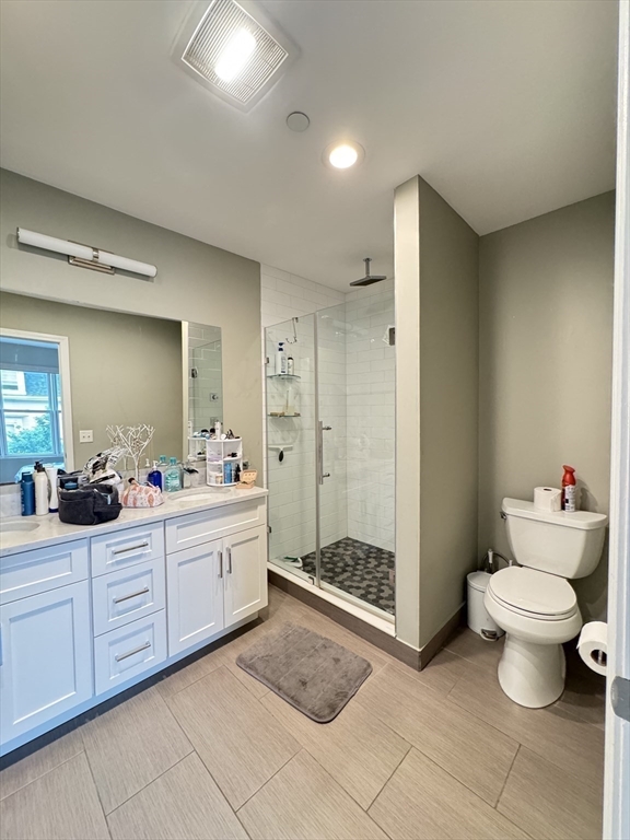 278 West Fifth Street, Unit 1 Boston, MA 02127 - Photo 17 of 22 a bathroom with a sink a toilet and shower