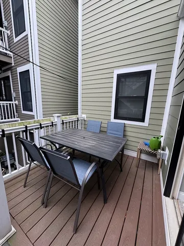 a terrace of a house with outdoor seating
