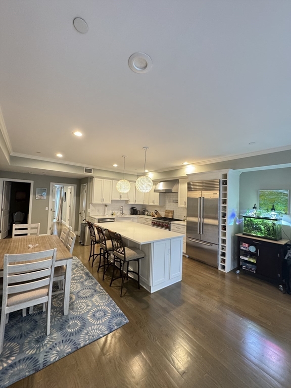 278 West Fifth Street, Unit 1 Boston, MA 02127 - Photo 2 of 22 a large kitchen with a table and chairs in it