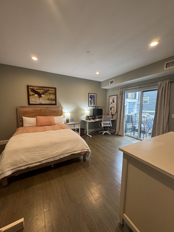 278 West Fifth Street, Unit 1 Boston, MA 02127 - Photo 9 of 22 a bedroom with a large bed and a large window