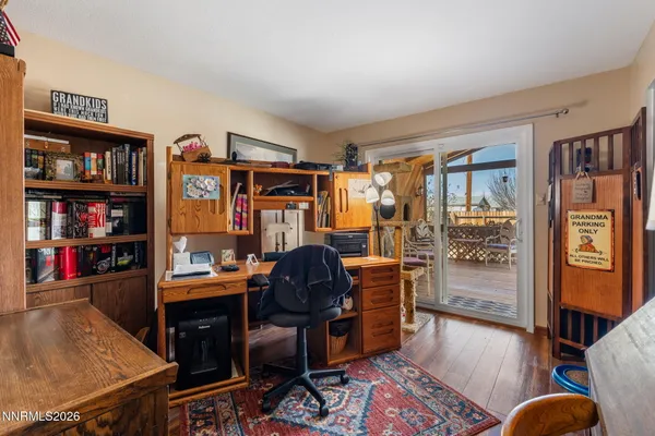 a view of a workspace with furniture and toys